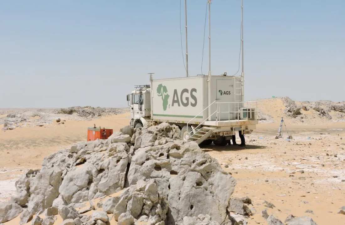 AGS recording truck on rocky desert ground